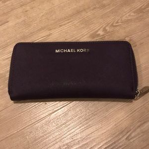 Purple Michael Kors zip around wallet